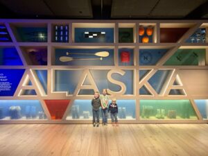 Alaska packing list summer image of three kids at the Anchorage museum